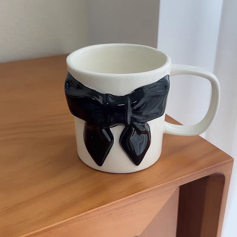 Bow-tie designed cup