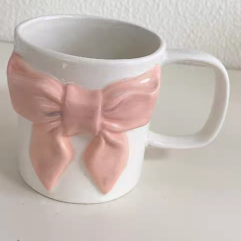Bow-tie designed cup