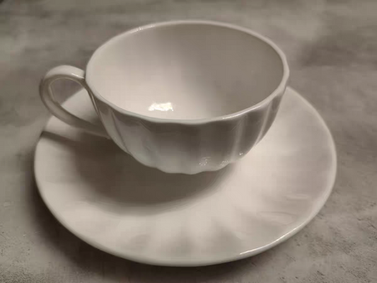 White porcelain cup and dish combination